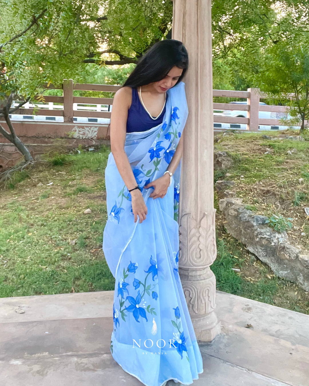 hand painted saree in pure organza silk by noor by hansa in sky blue colour paired with a blue blouse piece