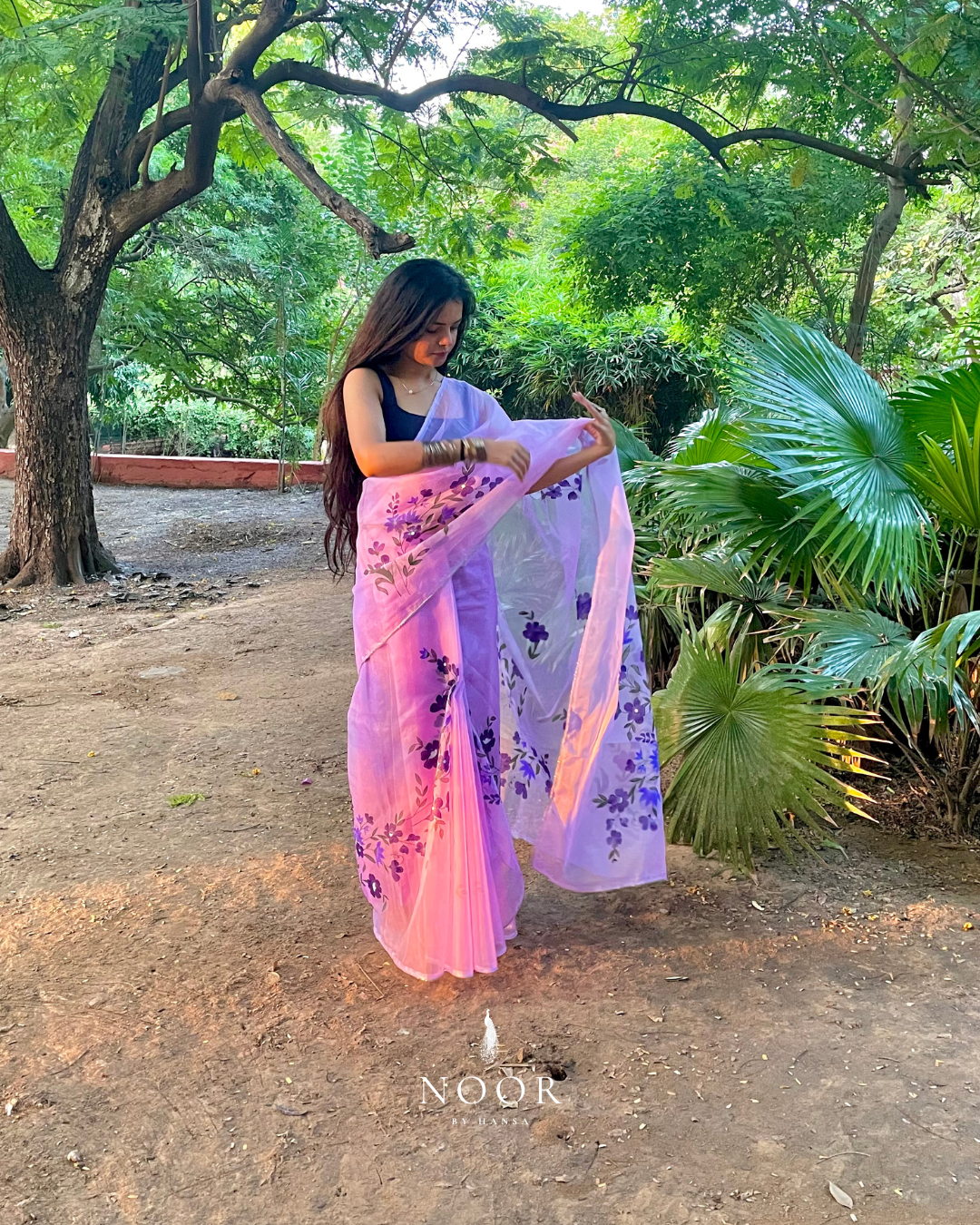 hand painted saree in pure organza silk by noor by hansa in lavender colour paired with a pure cotton blouse piece