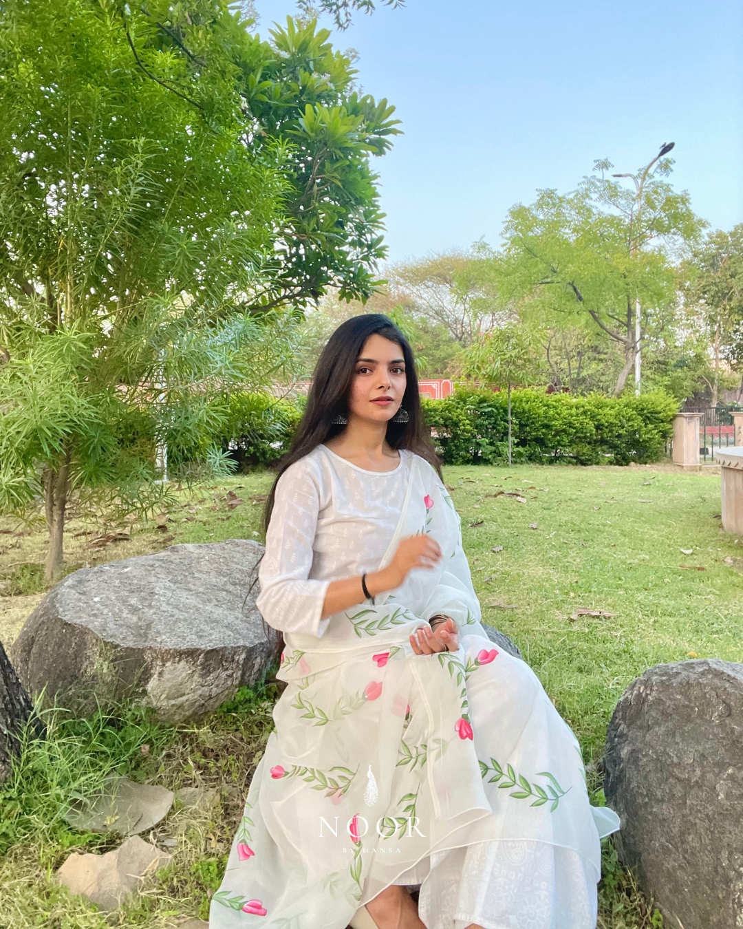 hand painted ivory 'jaituni' odhani in pure organza silk fabric with hand-painted motifs of leaves & pink tulips spread all over, embellished with studded stones. light and flowy, this makes for a perfect summer essential