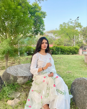 hand painted ivory 'jaituni' odhani in pure organza silk fabric with hand-painted motifs of leaves & pink tulips spread all over, embellished with studded stones. light and flowy, this makes for a perfect summer essential