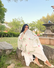 hand painted ivory 'jaituni' odhani in pure organza silk fabric with hand-painted motifs of leaves & pink tulips spread all over, embellished with studded stones. light and flowy, this makes for a perfect summer essential