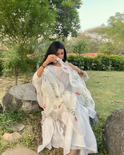 hand painted ivory 'jaituni' odhani in pure organza silk fabric with hand-painted motifs of leaves & pink tulips spread all over, embellished with studded stones. light and flowy, this makes for a perfect summer essential