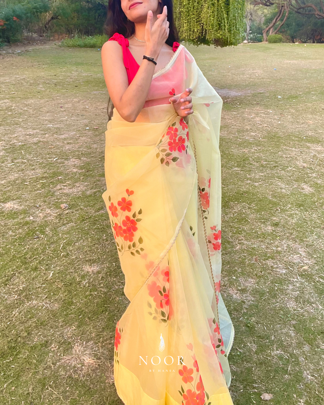 hand painted saree in pure organza silk by noor by hansa in yellow colour paired with a pure cotton blouse piece