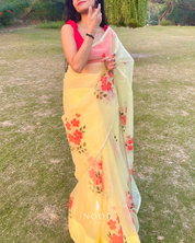 hand painted saree in pure organza silk by noor by hansa in yellow colour paired with a pure cotton blouse piece