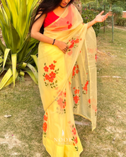 hand painted saree in pure organza silk by noor by hansa in yellow colour paired with a pure cotton blouse piece