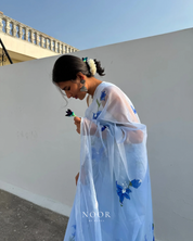 hand painted saree in pure organza silk by noor by hansa in sky blue colour paired with a white blouse piece