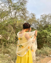our hand painted ivory 'fanaa' odhani in pure organza silk with whimsical yellow motifs, studded with minimal gold stones and edged with fringes
