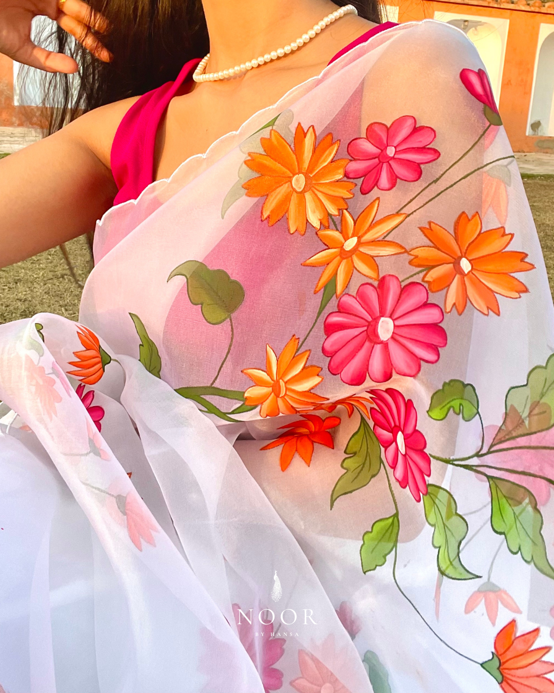 hand painted saree in pure organza silk by noor by hansa in white colour paired with a pure cotton blouse piece & scallop cutwork