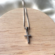 Zircon cross locket